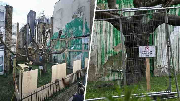 Mural de Banksy que apareció recientemente en Londres es protegido con láminas de plásticos, rejas y tablas
